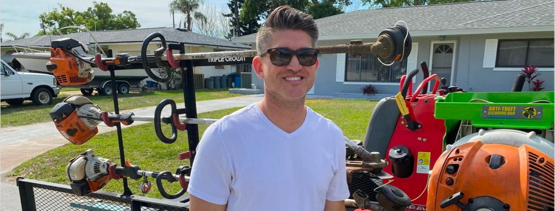 Close-up of a smiling man in a casual setting, conveying a friendly and approachable demeanor.